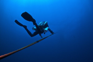 Kim on his rebreather leaving the Key Biscayne Wreck.  Ca... by Mick Tait 